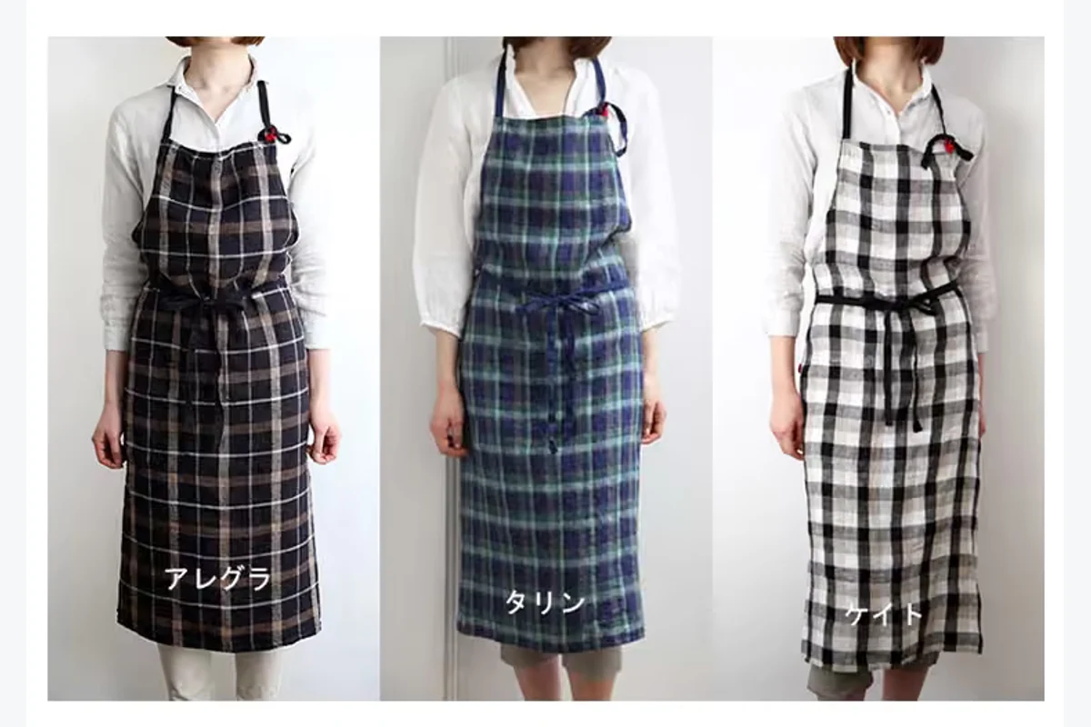 Three bib aprons with dark plaid, blue-green plaid, and black-and-white checks.
