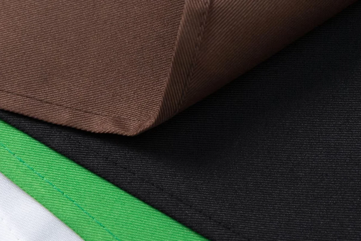 Green, brown, and black apron materials shown together.