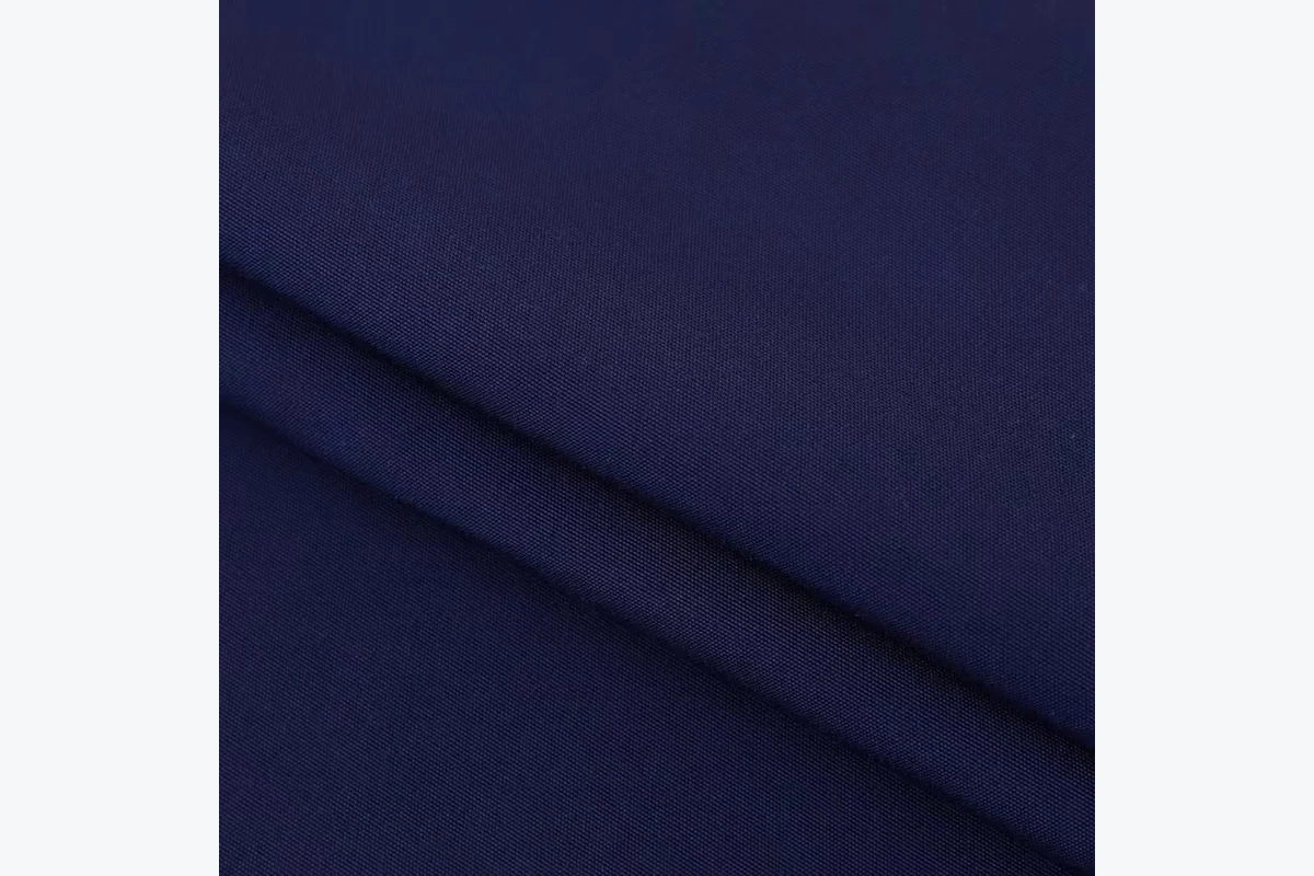 Dark blue woven apron fabric shown close up.