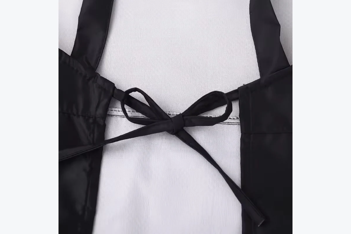 Black apron straps tied at the back.
