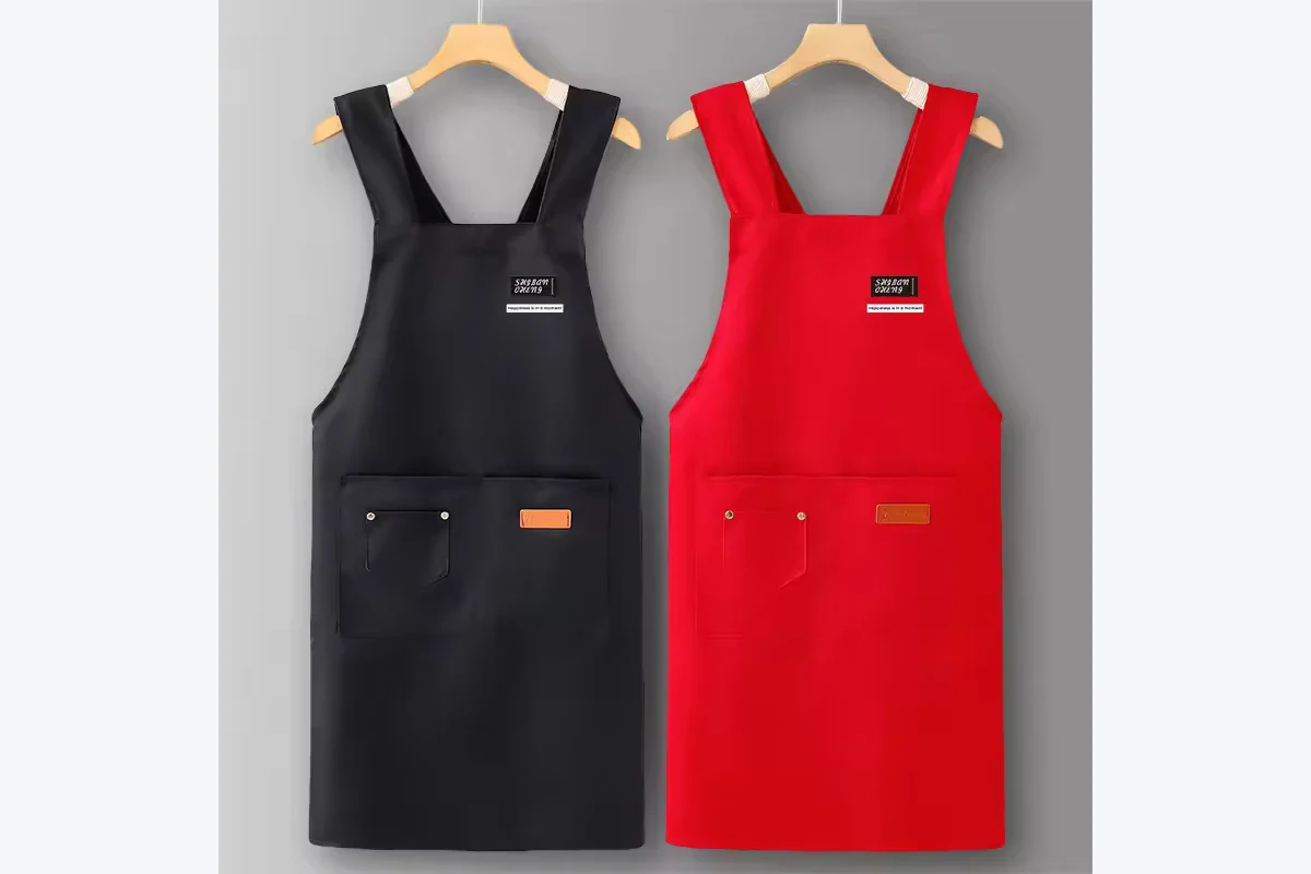Black and red aprons hanging side by side.