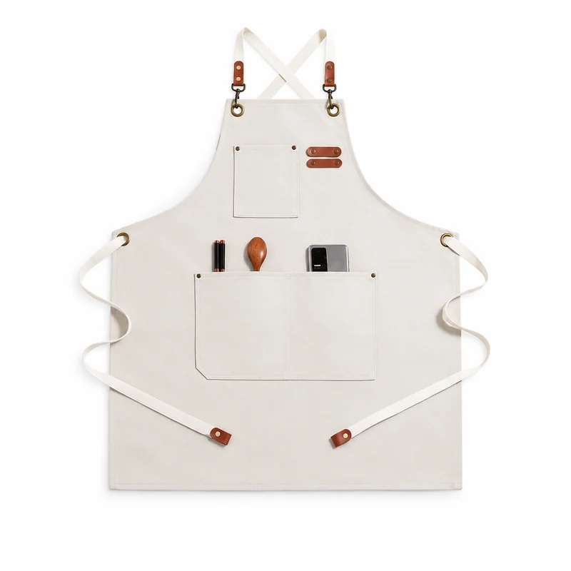 White apron with crossed straps and multiple front pockets.
