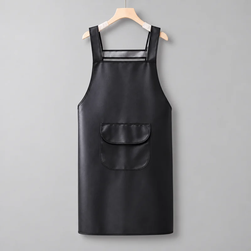 Black apron with a smooth surface and a flap pocket.