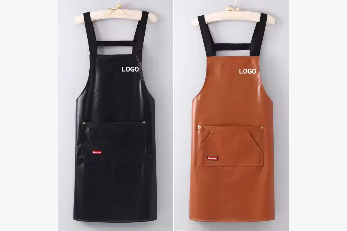 Black and brown aprons hanging side by side.