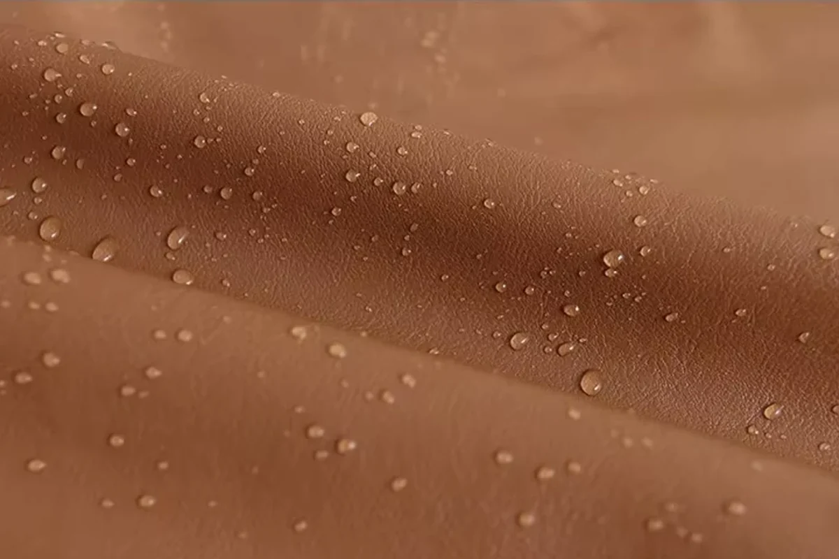 Close view of brown material with a visible surface grain.