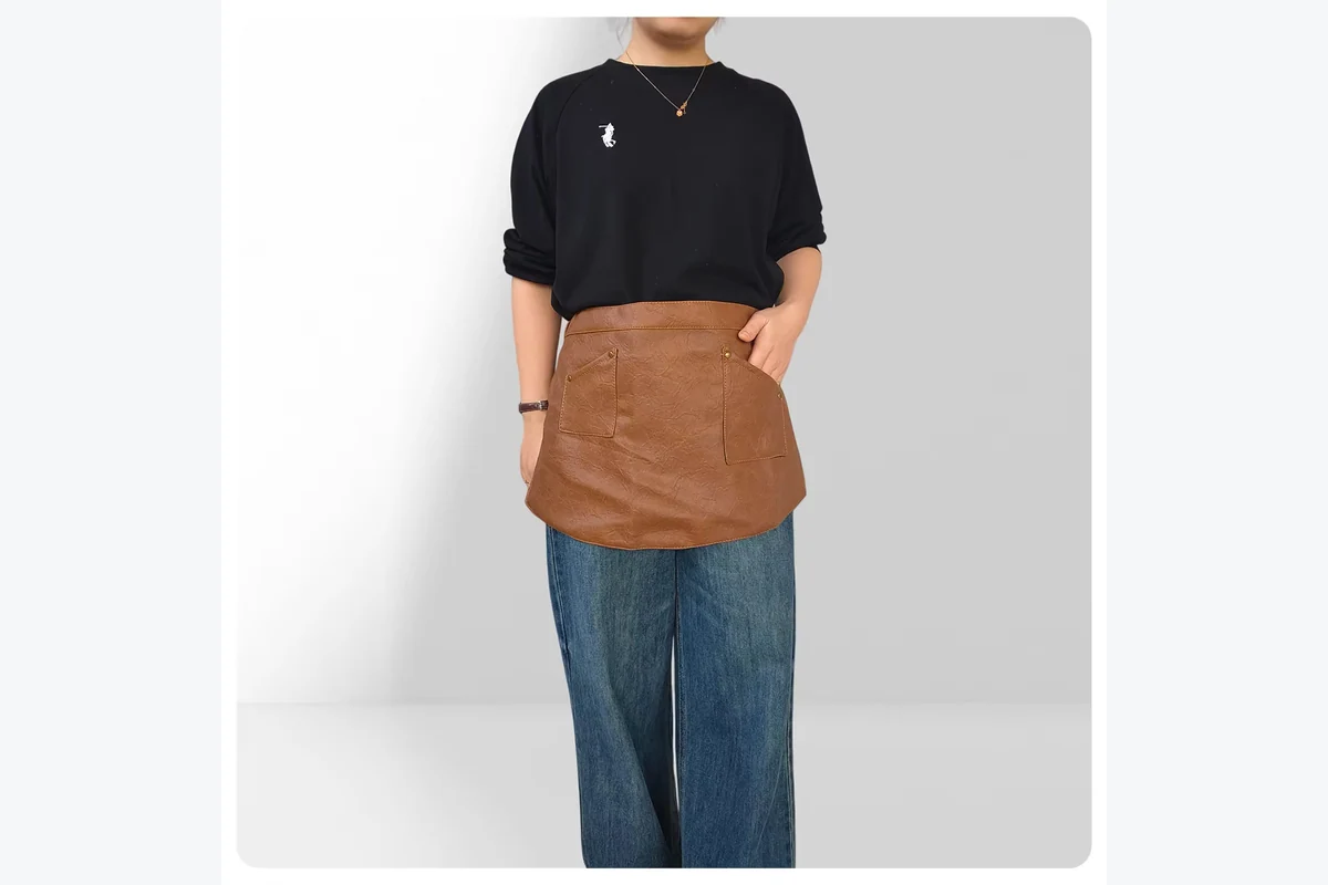 Brown waist apron viewed from the front.