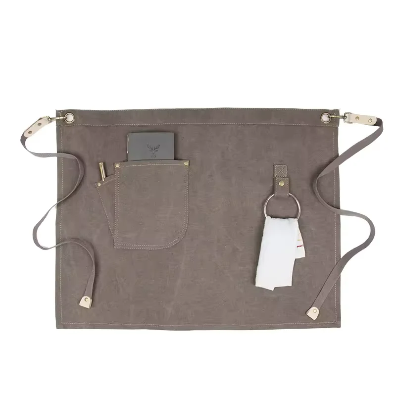 Gray waist apron with storage pockets, metal rings, and side loops.