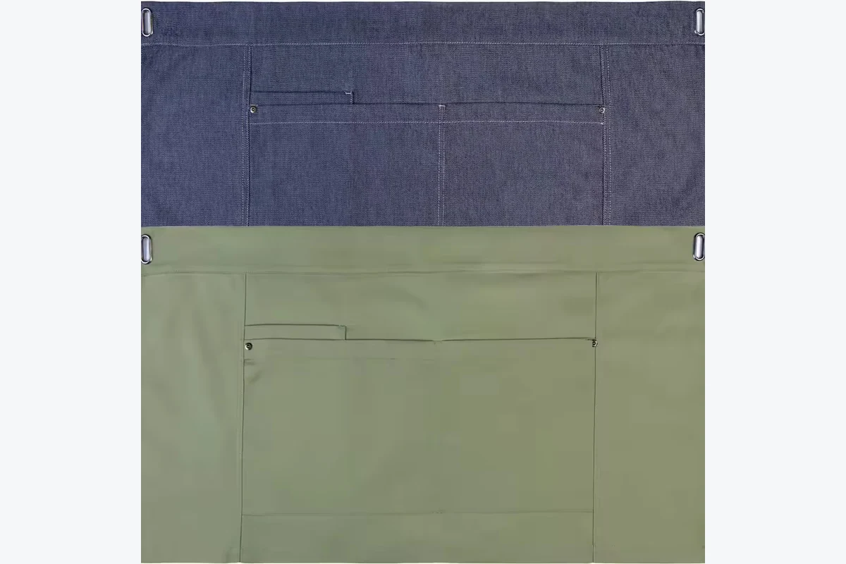 Navy and olive waist aprons with front pockets.