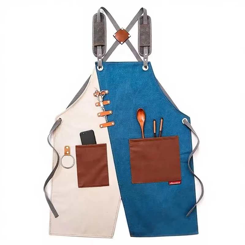 Blue and cream work aprons with contrasting brown pockets and strap tabs.