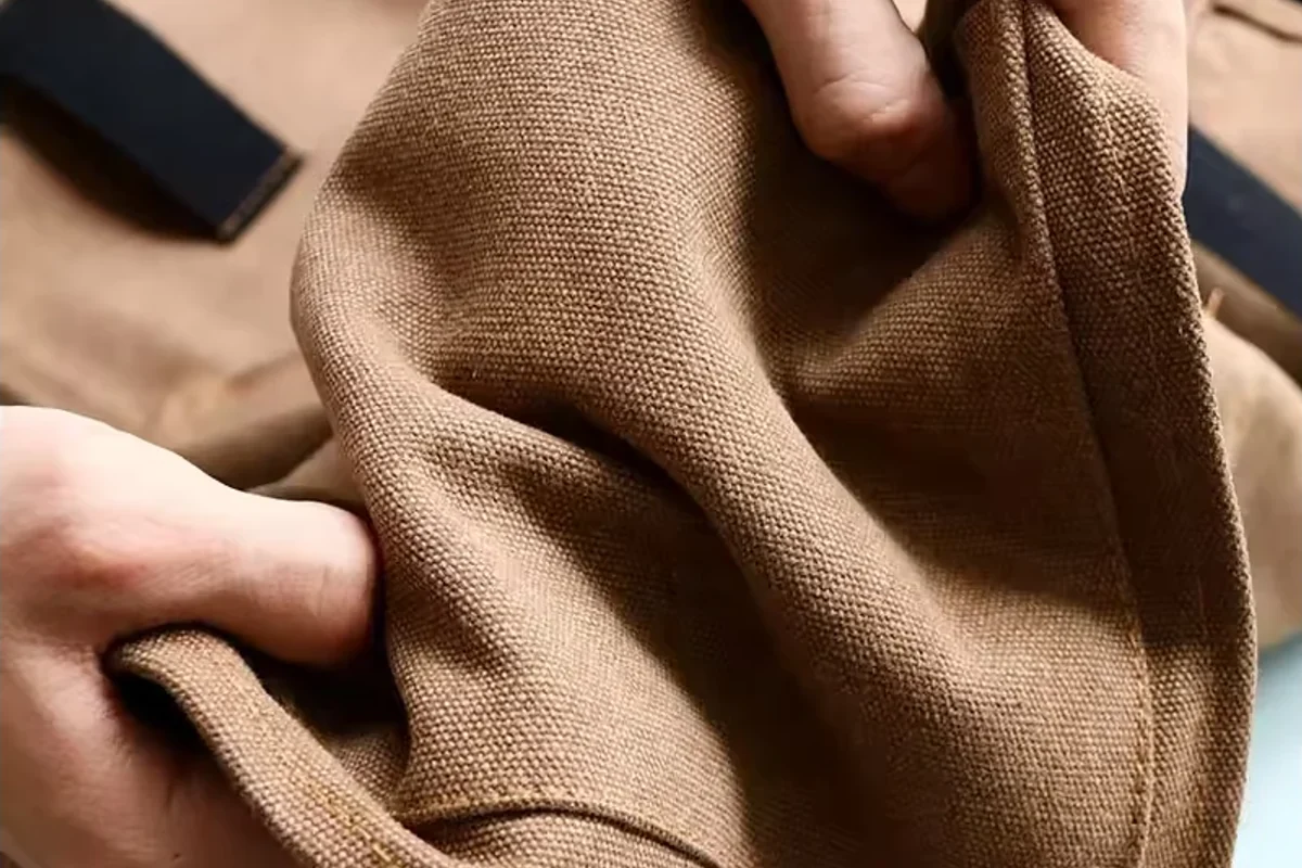 Brown woven material gathered by hand.