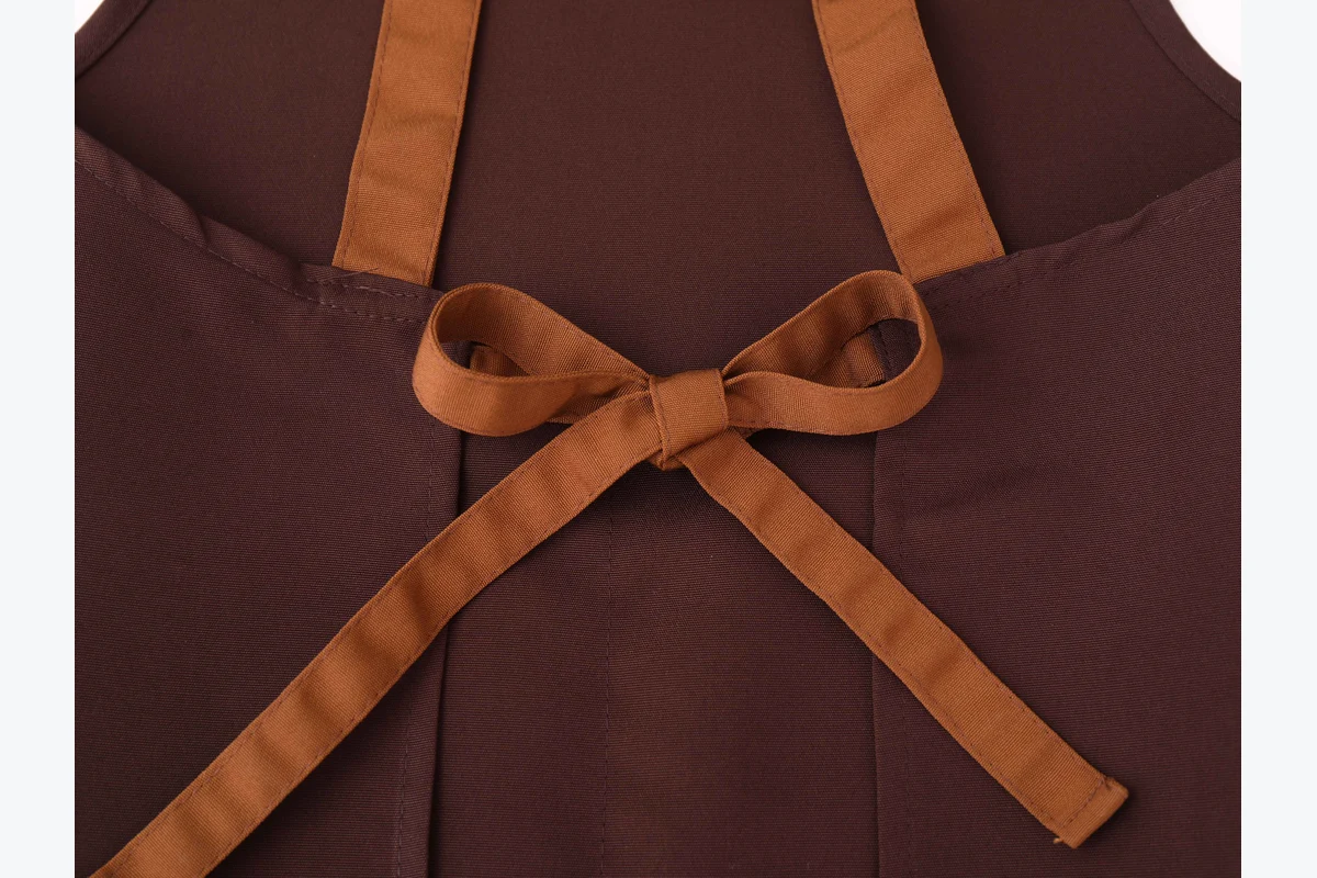 Brown apron straps tied at the back.