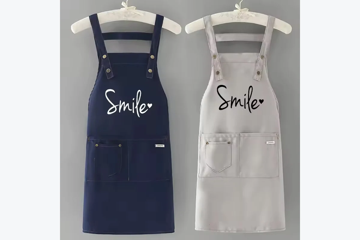 Navy and light gray aprons with Smile lettering.